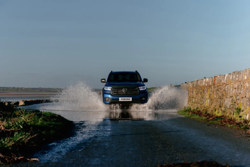 Blue GWM POER 300 driving through puddle 