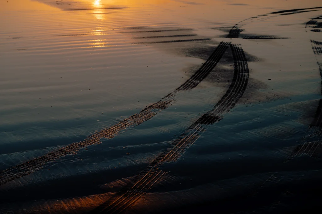 POER 300 tyre tracks on wet beach